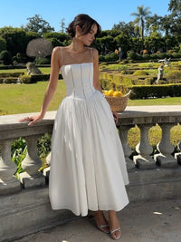 Elegante vestido de invitada de boda con corsé y escote favorecedor de fiesta | Midi