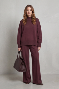 Conjunto de punto mujer con jersey de cuello alto y pantalones anchos