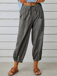 Estilosos pantalones anchos baggy de corte cropped con cintura elástica y puño jogger