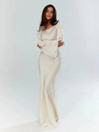 Elegante vestido largo de invitada de boda con manga larga y silueta fluida | Maxi