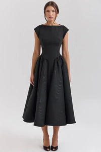 Refinado vestido de invitada de boda con manga corta y falda amplia en negro y blanco | Midi